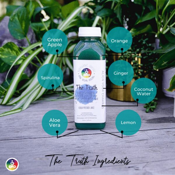 A table with a bottle of our signature juice, the Truth. It contains Aloe Vera, lemon, ginger, coconut water, spirulina, green apple, and orange.